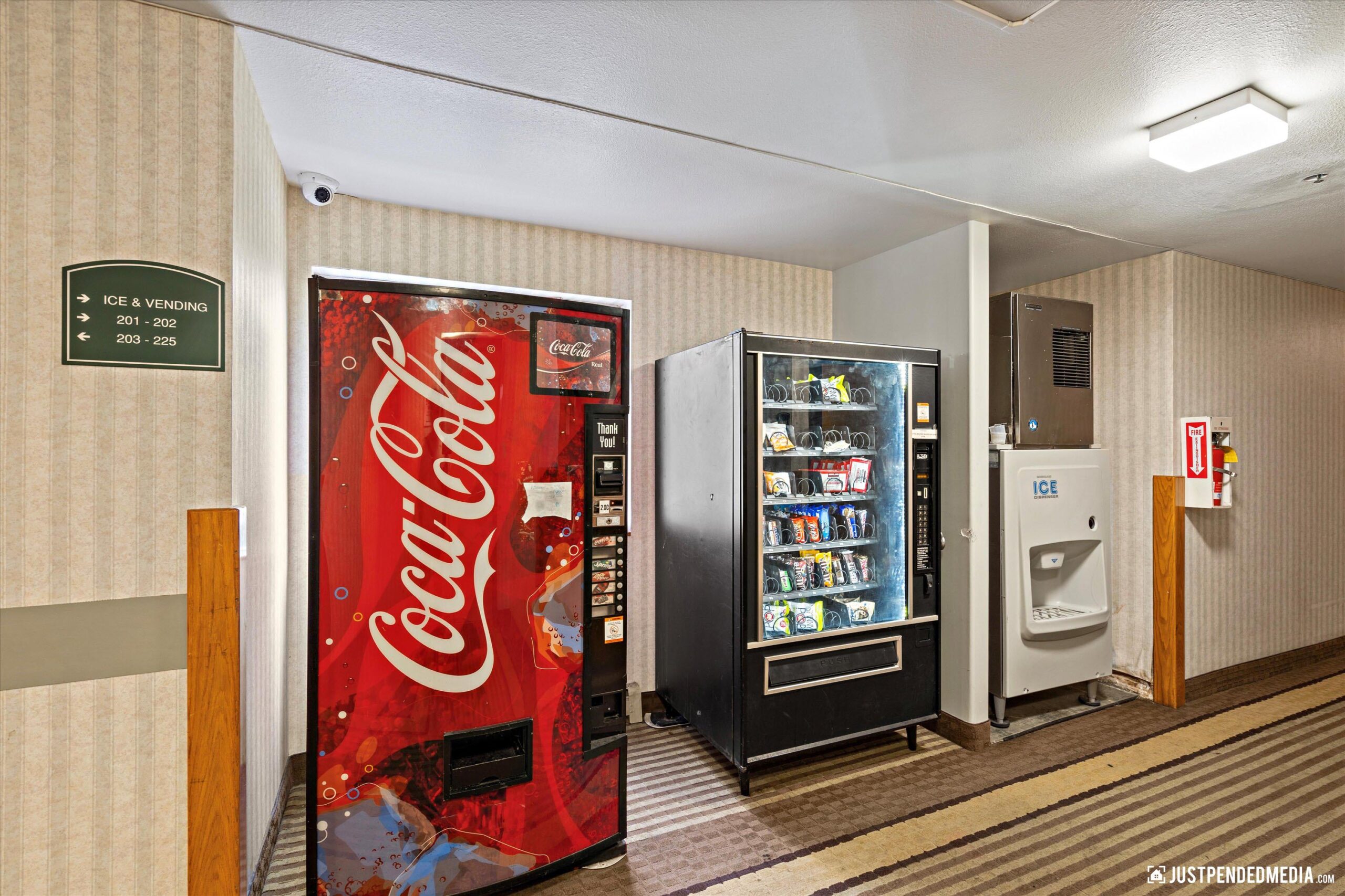 Interior lobby of The Guesthouse with an ice machine and two vending machines